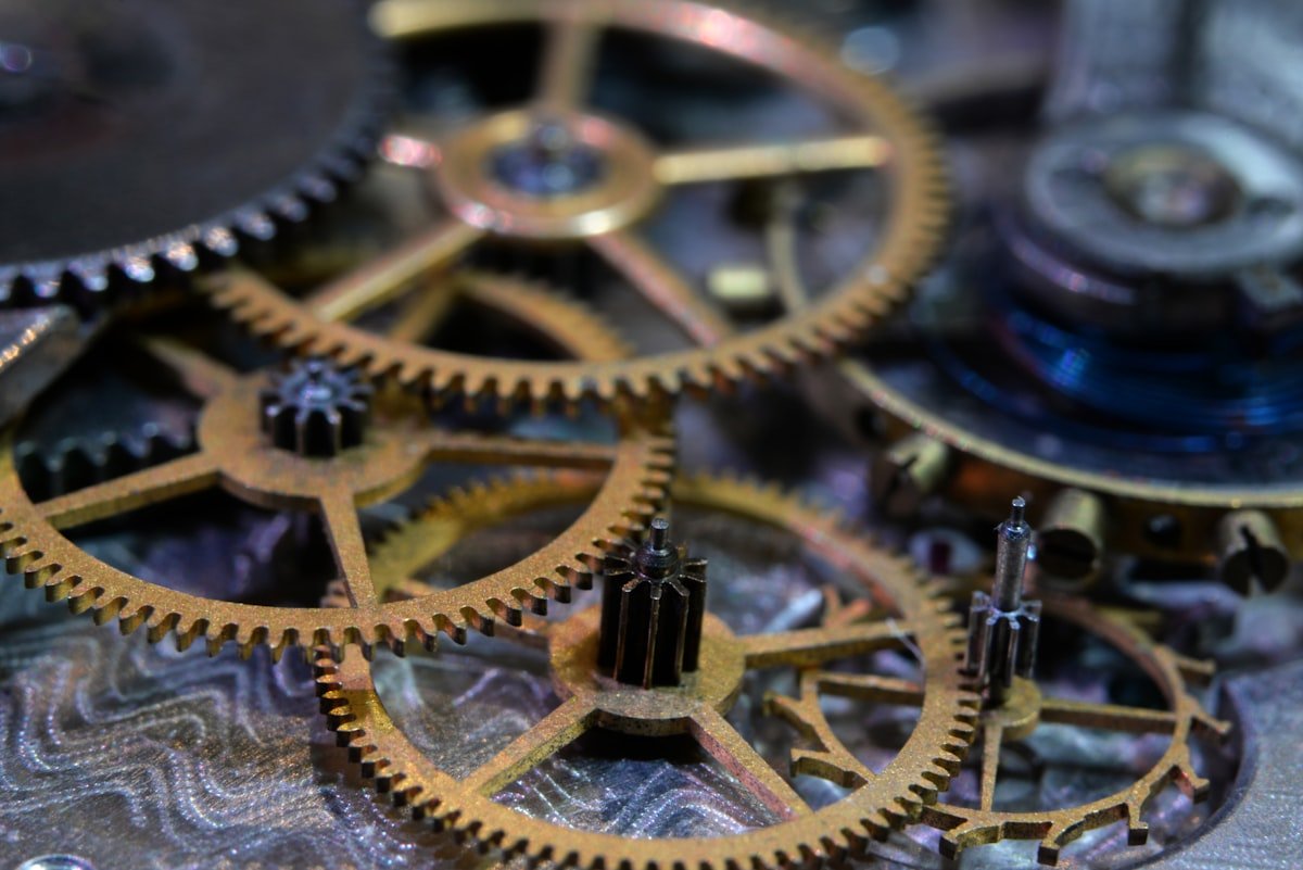 Close-up of interlocking brass gears